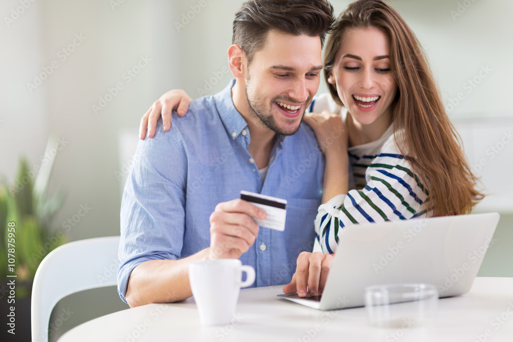 Couple using laptop together Couple using laptop together