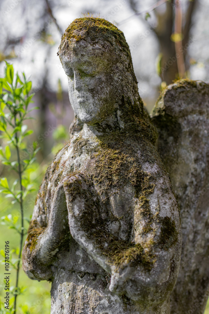 Statue of angel on grave Statue of angel on grave