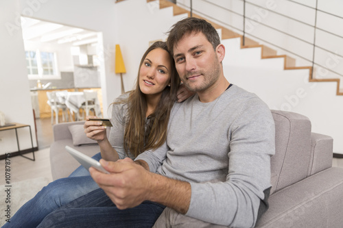 Young couple buying on the internet photo