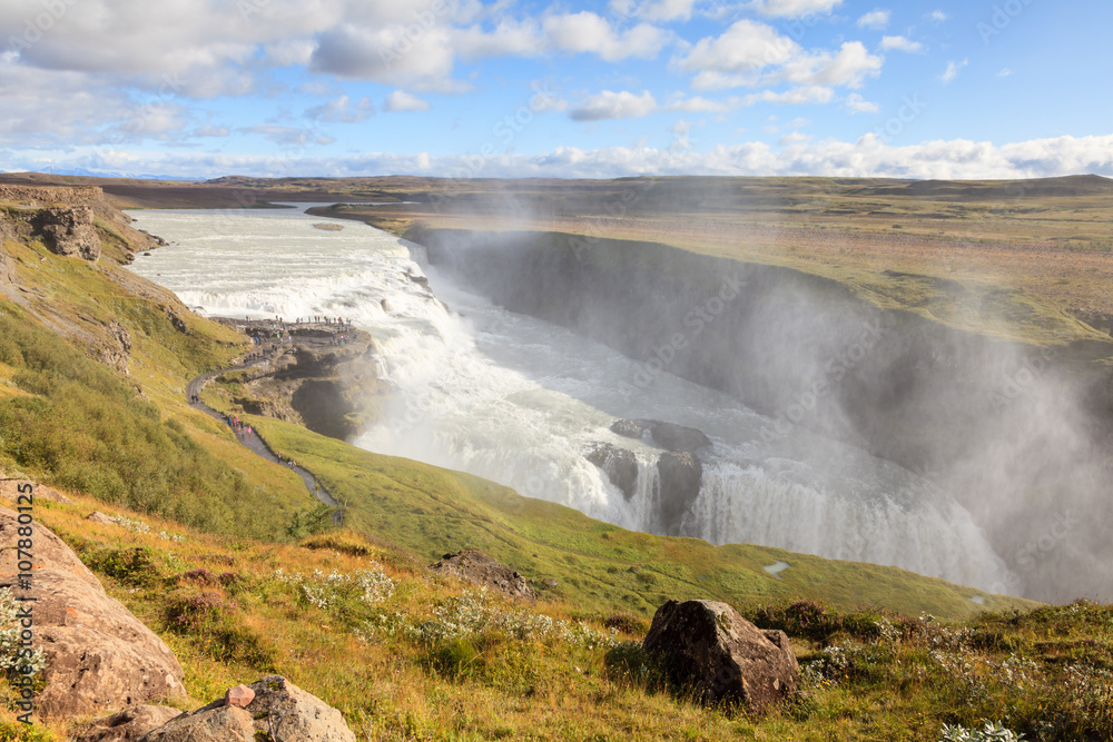 Gullfoss Waterfall.  The view back along the Hvita (white river) river towards Gullfoss (Golden Falls) waterfall in Iceland.  The waterfall forms a part of the popular Golden Circle tourist trail.