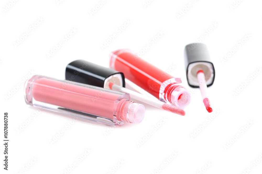 Pink and red lip gloss isolated on a white
