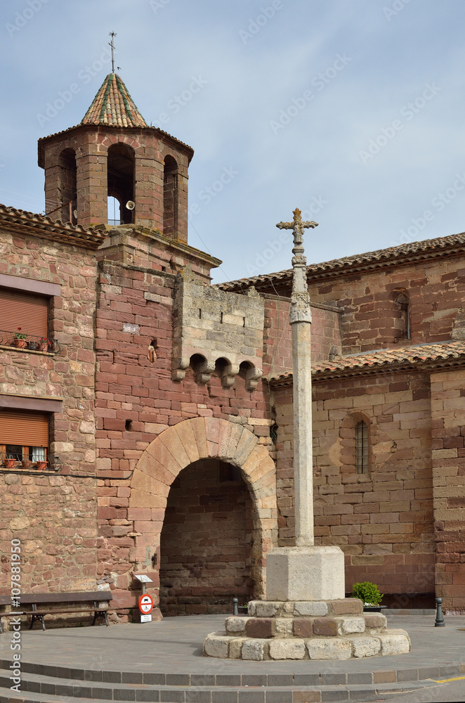 The boundary cross and the ancient gate in the Spanish town Prades