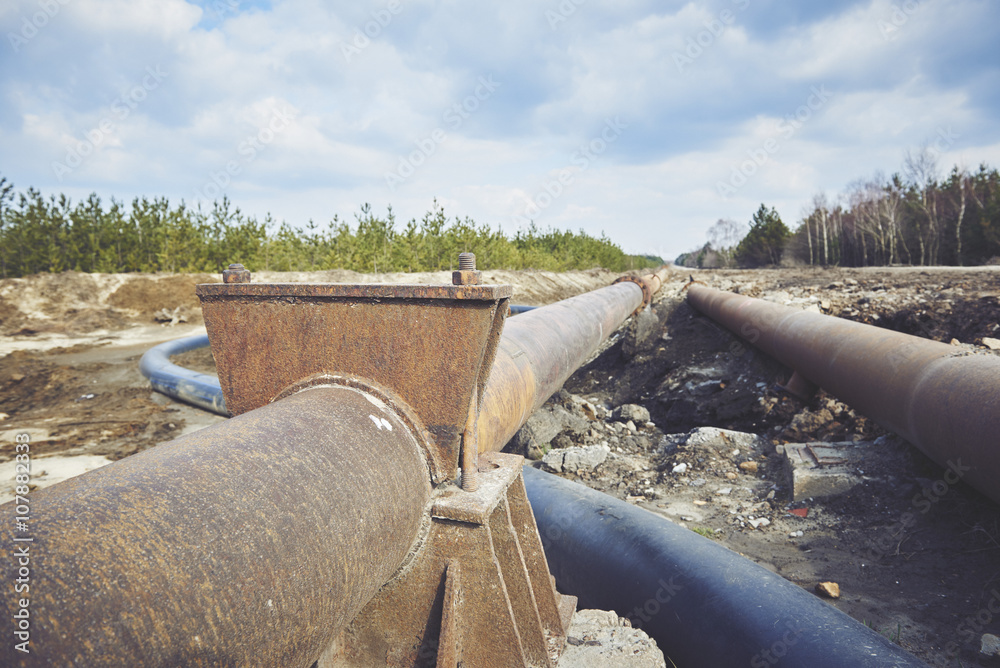 Steal big pipeline on a ground. Old pipes joint.
Steal big pipeline on a ground. Old pipes joint.