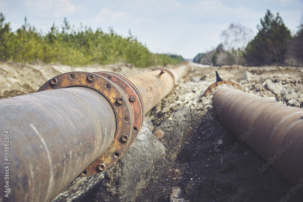 Steal big pipeline on a ground. Old pipes joint.
Steal big pipeline on a ground. Old pipes joint.