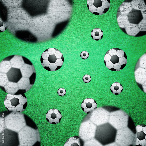 Abstract many soccer balls on green grass background. Blurred and grunge textured soccer balls on green football field background. Conceptual soccer balls background. Square composition used.