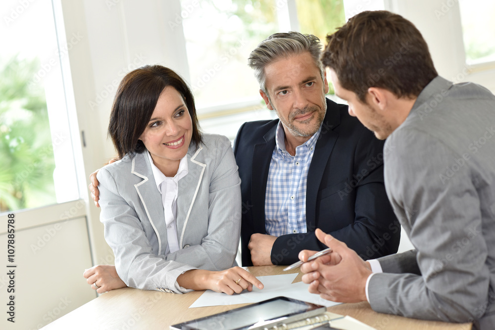 Mature couple meeting with realtor Mature couple meeting with realtor