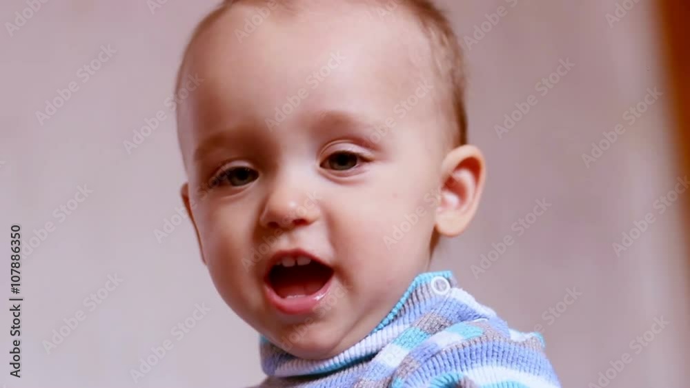 Little boy plays with toys and sharpens the teeth at home Little boy plays with toys and sharpens the teeth at home