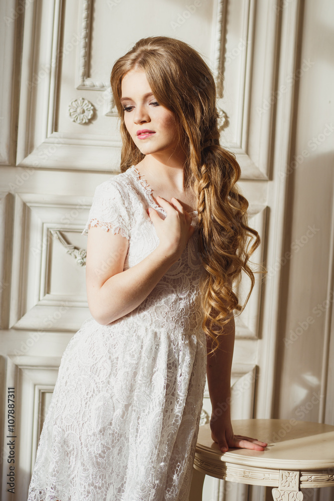 Portrait of pretty young girl in a white dress and long blonde hair Portrait of pretty young girl in a white dress and long blonde hair