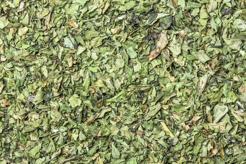 Dry coriander herb background.