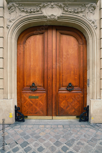 Black door knobs on the wodeen door photo