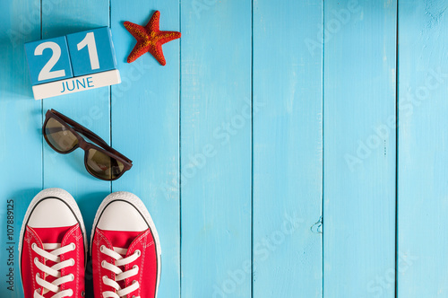 June 21st. Image of june 21 wooden color calendar on blue background. Summer day. Empty space for text. Go Skateboarding Day