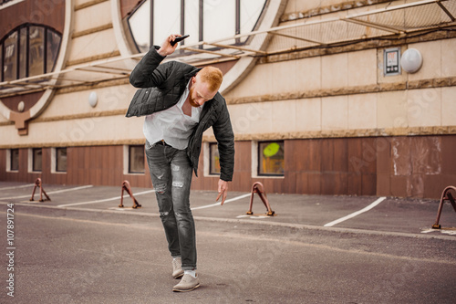 angry man is throwing away his mobile phone © fesenko