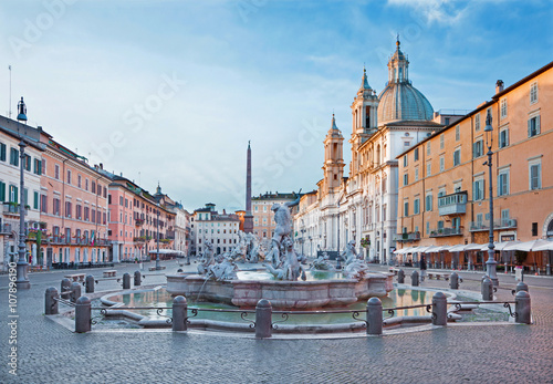 ROME, ITALY - MARCH 12, 2016: Piazza Navona in morning and Fountain of Neptune (1574) created by Giacomo della Porta and Santa Agnese in Agone church photo