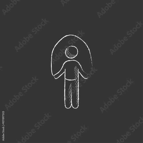 Man exercising with skipping rope. Drawn in chalk icon.