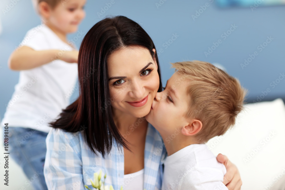Family concept. Sons greeting mother, close up
