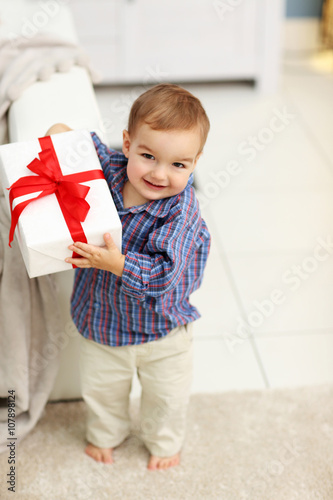 Cute baby with gift box in ...