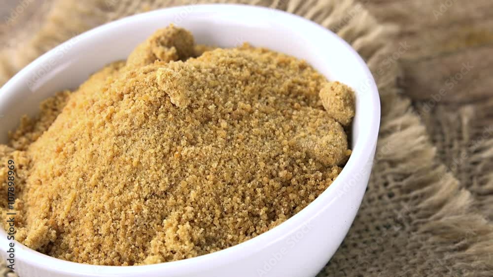 Portion of rotating Coconut Sugar as seamless loopable 4K UHD footage Portion of rotating Coconut Sugar as seamless loopable 4K UHD footage