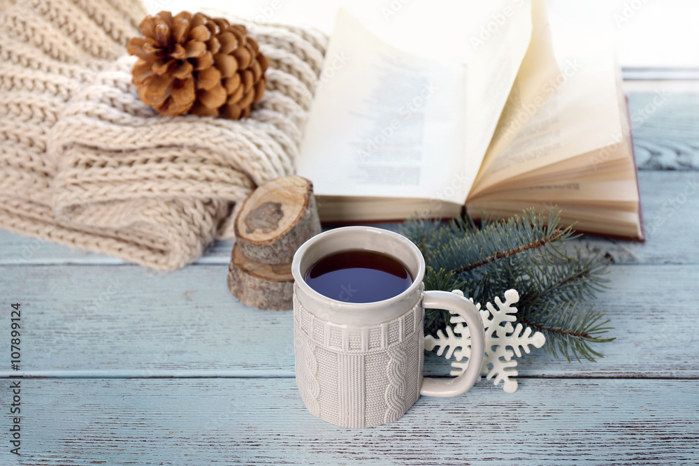 Beautiful winter composition on windowsill with cup of hot drink Beautiful winter composition on windowsill with cup of hot drink