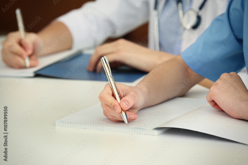 doctors hands writing at table closeup doctors hands writing at table closeup