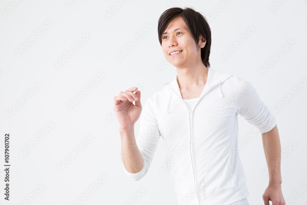 young asian man running isolated on white background