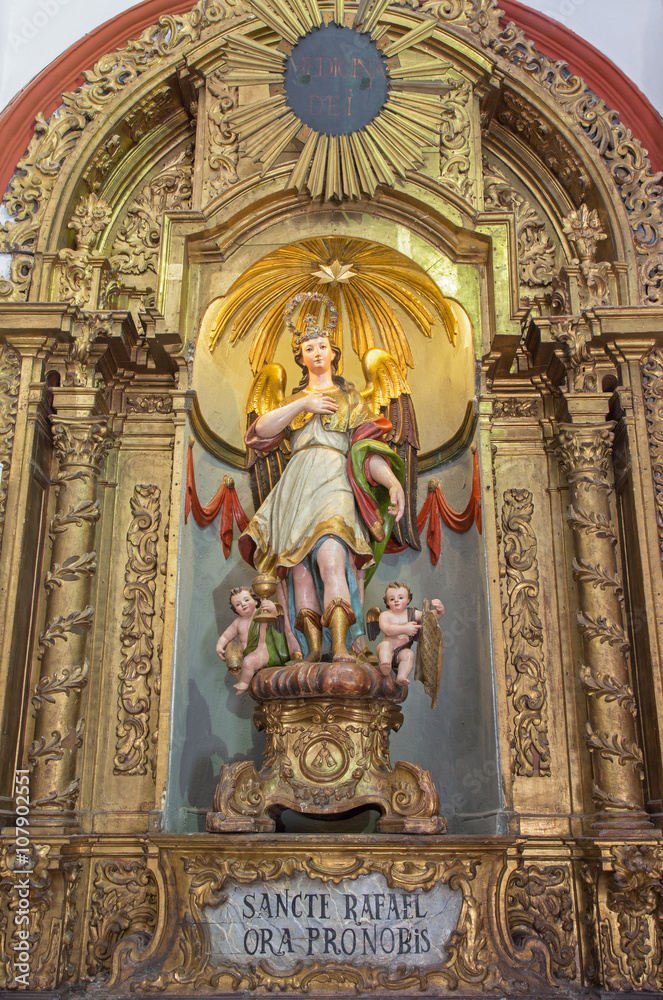 Cordoba - carved and polychrome statue of archangel Raphael in Church Eremita de Nuestra Senora del Socorro 