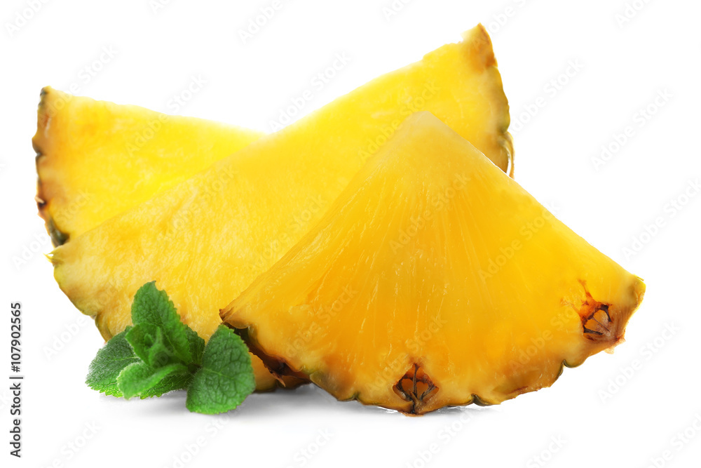 Juicy pineapple slices with fresh mint, isolated on white Juicy pineapple slices with fresh mint, isolated on white