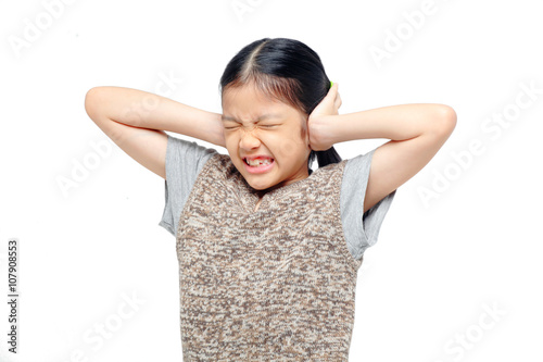 asian girl covering her ears with hands.