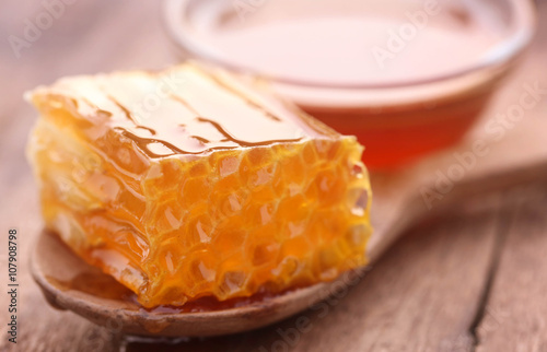 Honeycomb in a wooden spoon