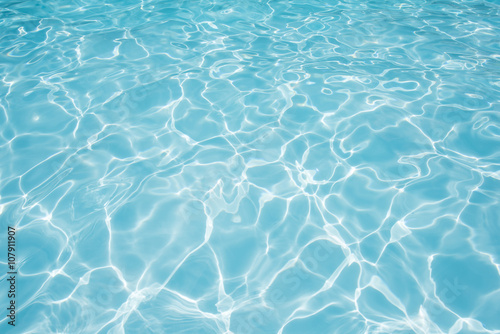 Pattern of ripple wave with sun reflection in swimming pool