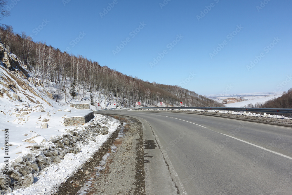 Mountain highway among snow slope , Belokurikha, Altai, Russia Mountain highway among snow slope , Belokurikha, Altai, Russia
