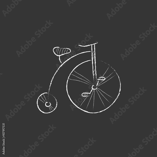Old bicycle with big wheel. Drawn in chalk icon.