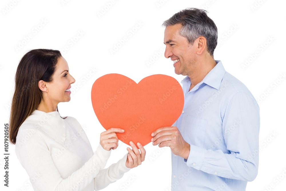 Lovely couple holding big heart