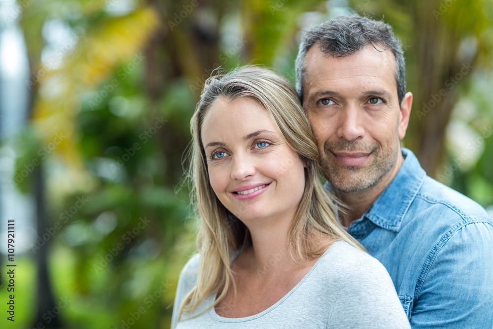 Couple looking away and smiling