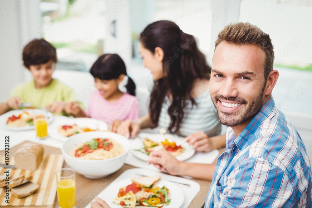 Portrait of smiling father with family 