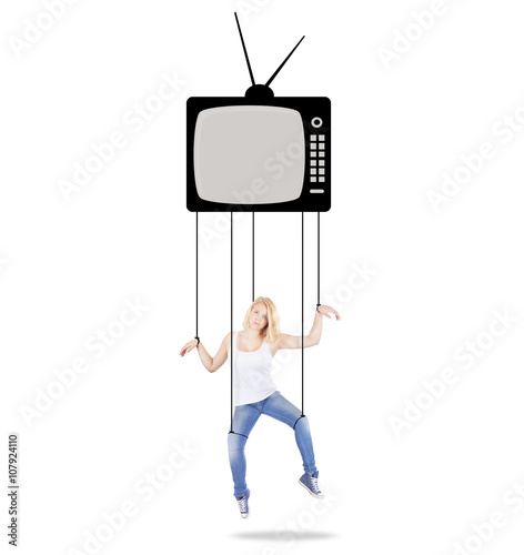 Girl being held as a marionette by TV and Media, concept photo