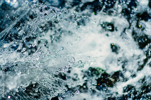 close up water drops in a blurred background colorful