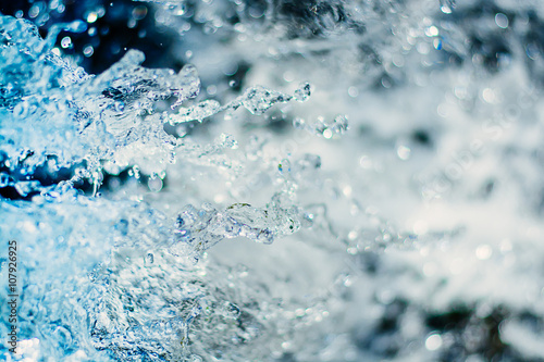 close up water drops in a blurred background colorful