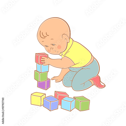Little lovely baby boy playing with toys. Kid builds house from