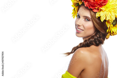 Beautiful Young Woman with Summer  Flowers. Long Permed Curly Ha