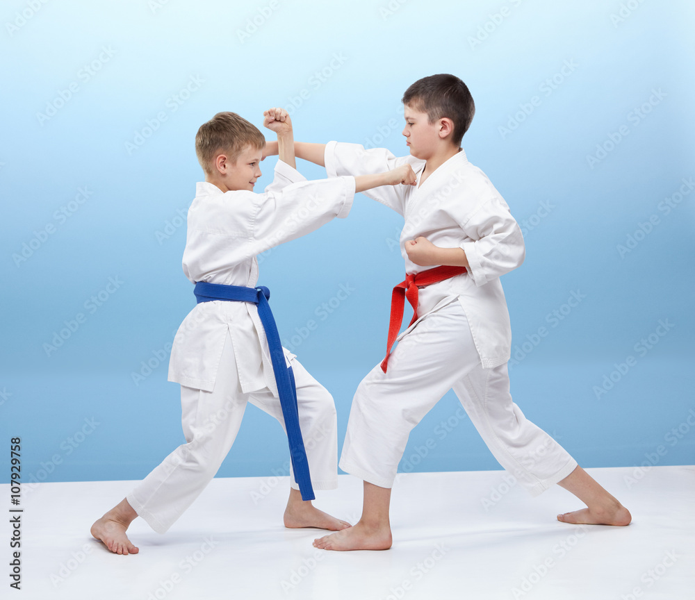 Fototapeta premium Athletes are hitting a punch and making the block