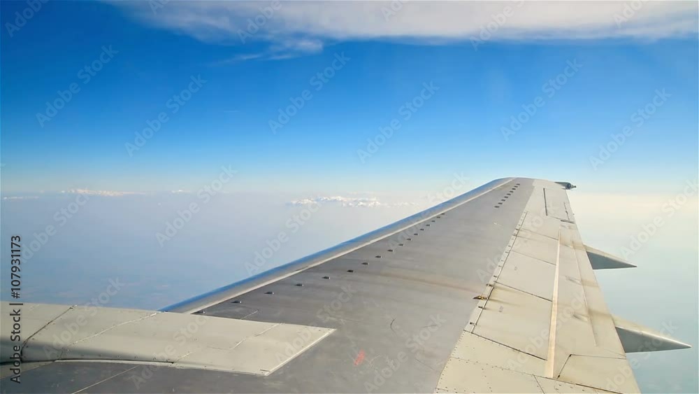 Above The Clouds Blue Sky View From Flying Airplane Window