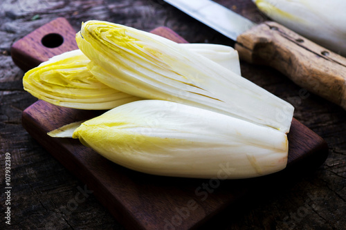 Fresh Chicory Salad  on  rustic wooden table. photo
