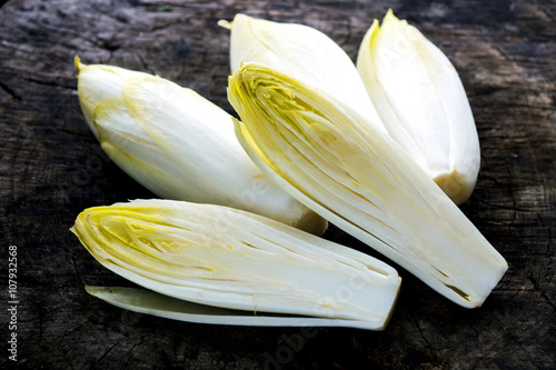 Fresh Chicory Salad  on  rustic wooden table. photo