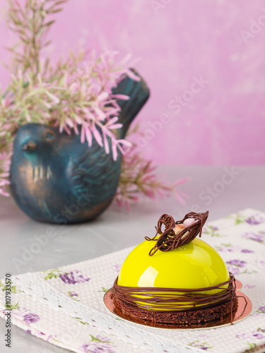 Mini mousse cake with green glaze photo