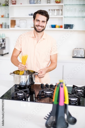 Man cooking spaghetti