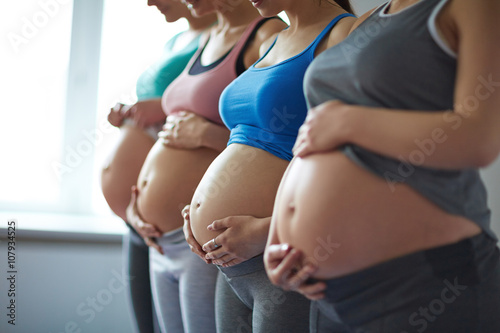 Row of pregnant women