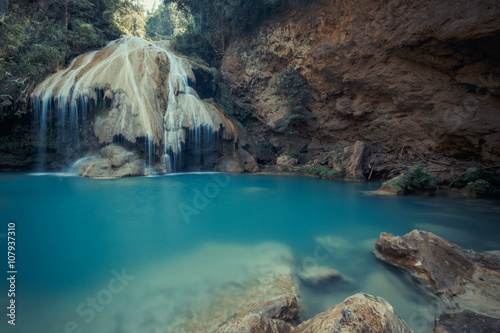 wonderful waterfall with colorful tree in thailand