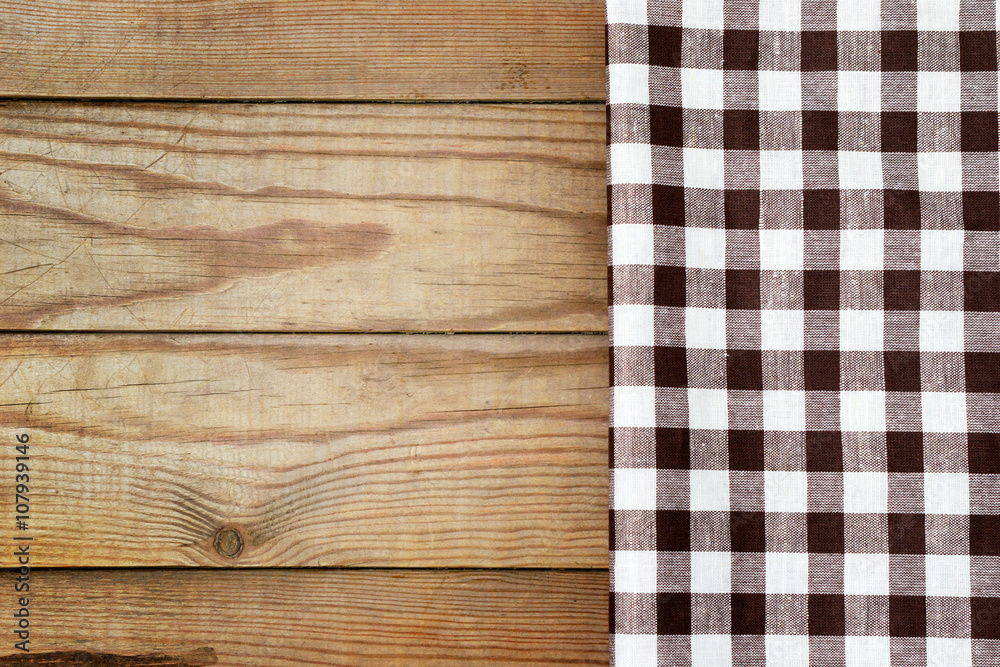 Checkered tablecloth on a table in a rustic style.