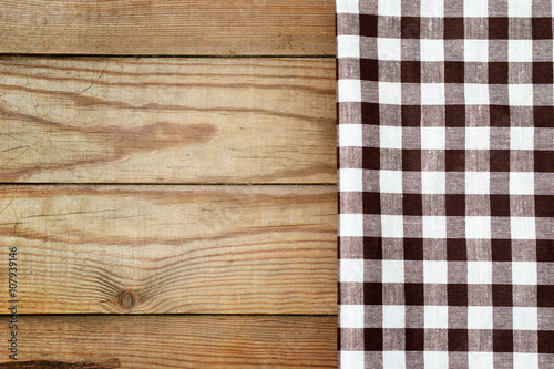 Checkered tablecloth on a table in a rustic style.
