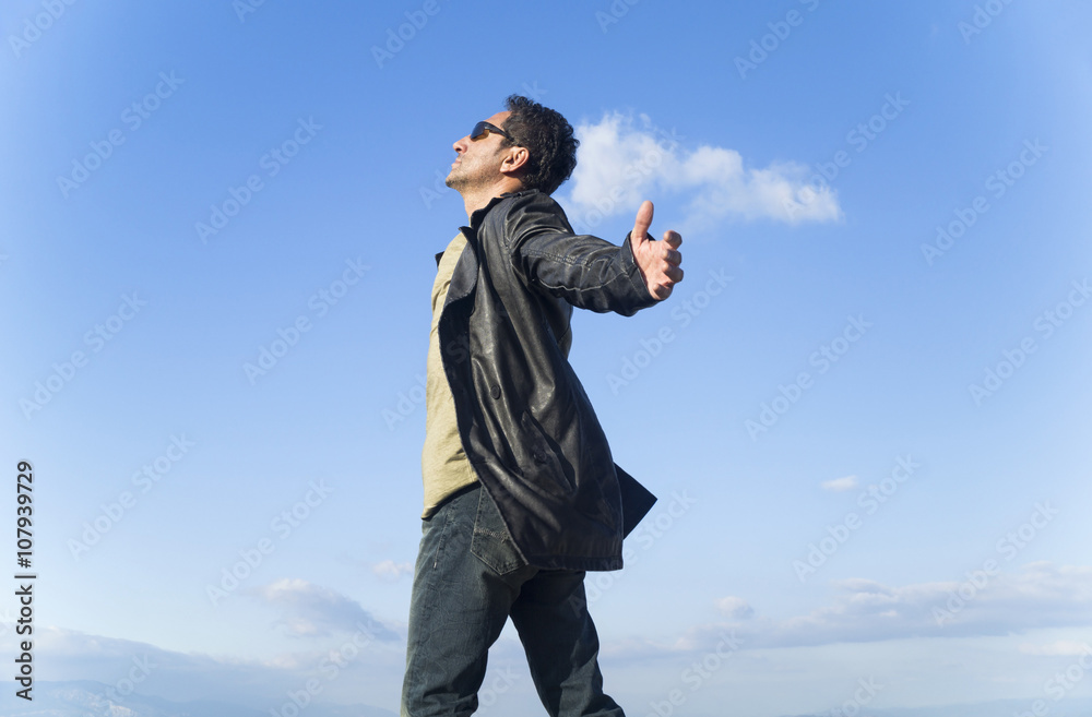 Healthy and happy young man greets the nature Healthy and happy young man greets the nature